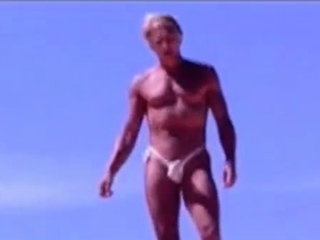 Tanned guy on beach in tiny string thong (temporarily!)